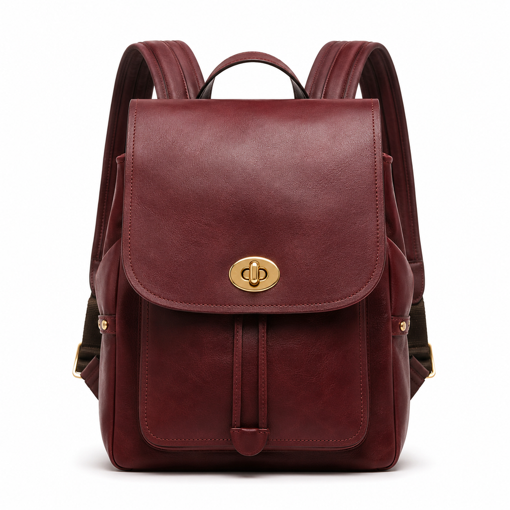 Front view of burgundy leather backpack with gold hardware.