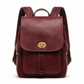 Front view of burgundy leather backpack with gold hardware.