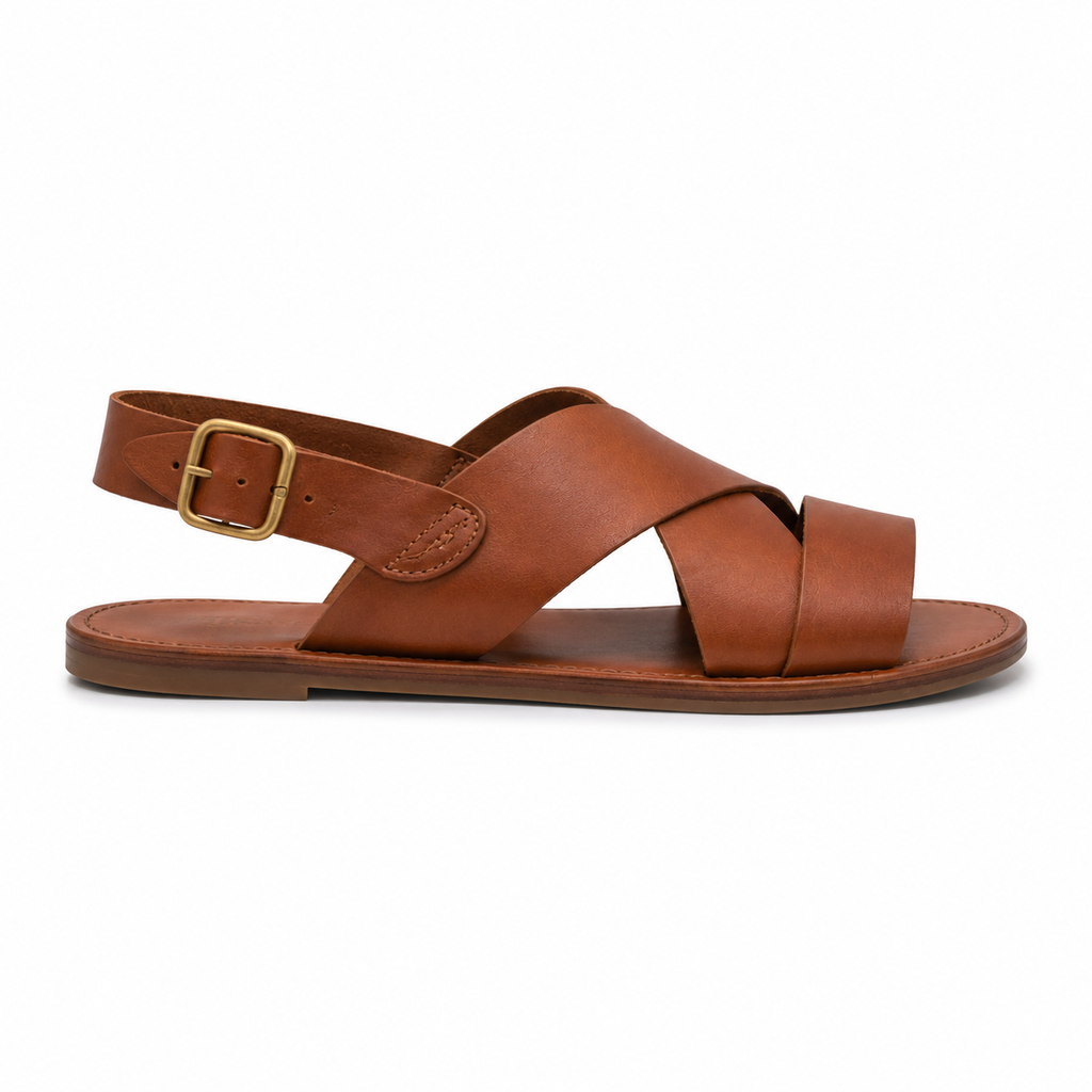Top view of tan leather sandals with cross straps.
