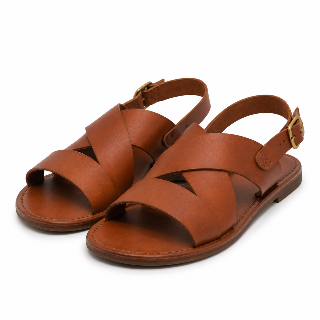 Side view showing buckle strap of tan leather sandals.
