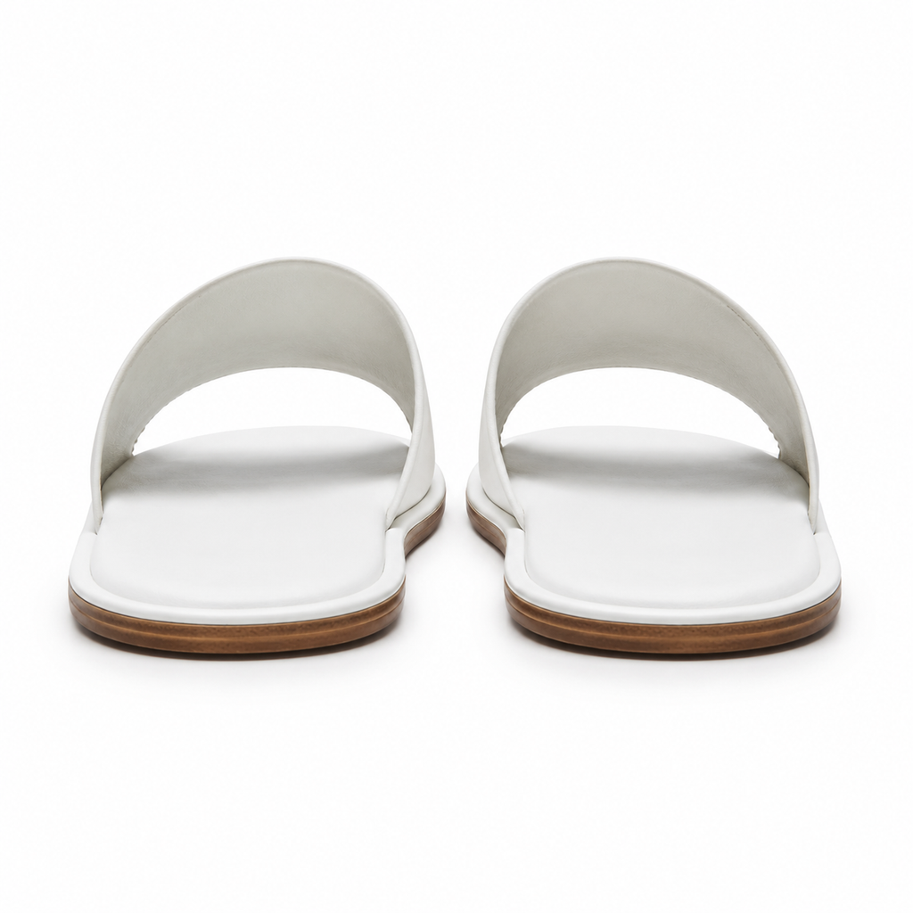 Rubber sole of white sandals for non-slip grip.