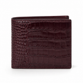 Front view of burgundy crocodile-embossed leather wallet.