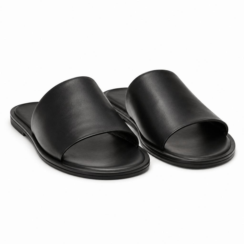 Side view of Modish-Vogue slide sandals in black leather.