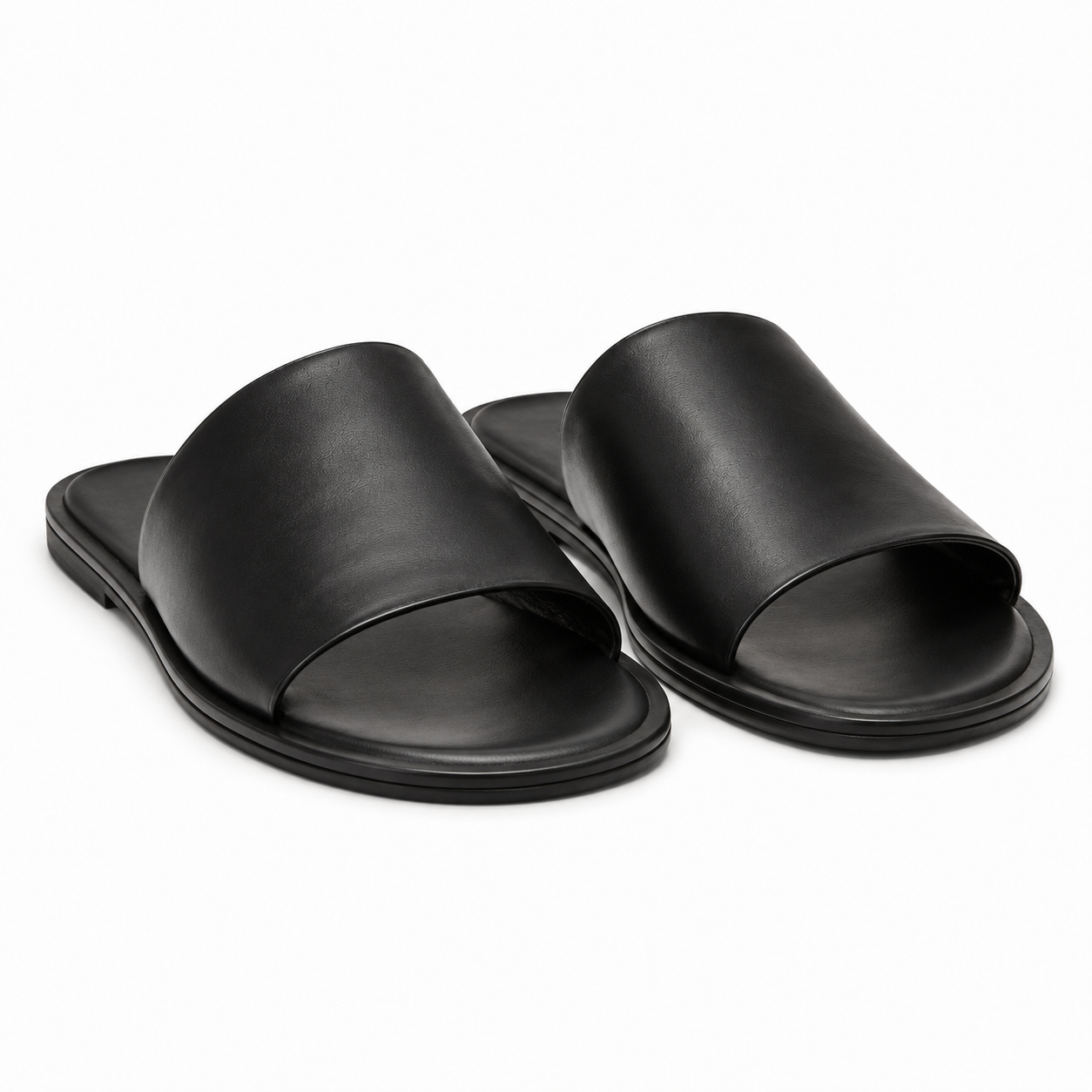 Side view of Modish-Vogue slide sandals in black leather.