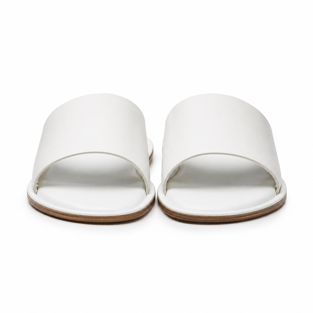 Front view of white leather slide sandals.