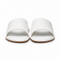Front view of white leather slide sandals.