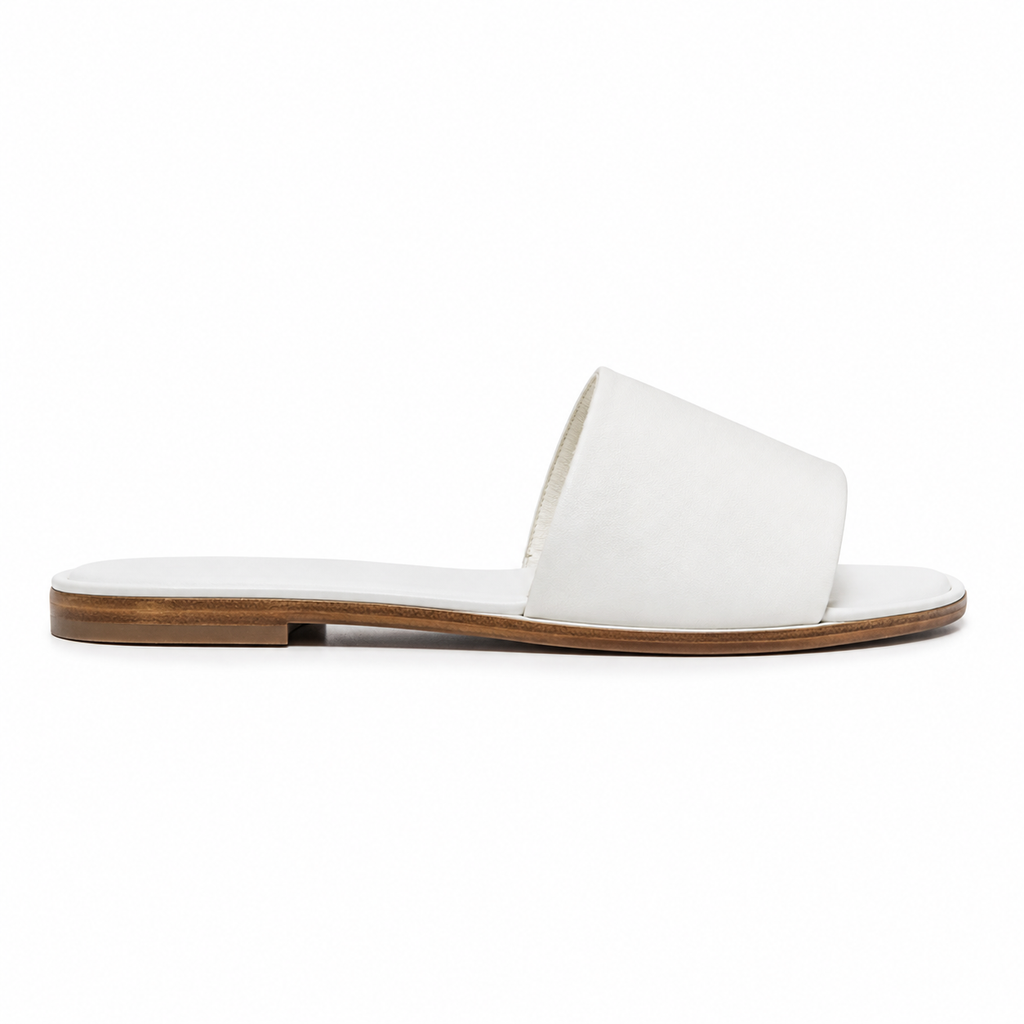 Top view of white slide sandals with cushioned footbed.