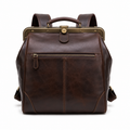 Front view of brown leather vintage backpack with brass frame.