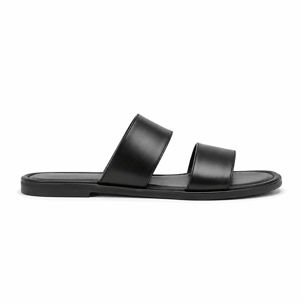 Close-up of double strap design on black sandals.