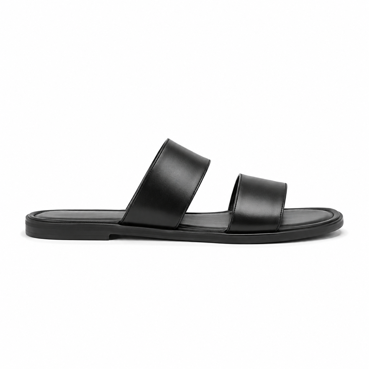 Close-up of double strap design on black sandals.