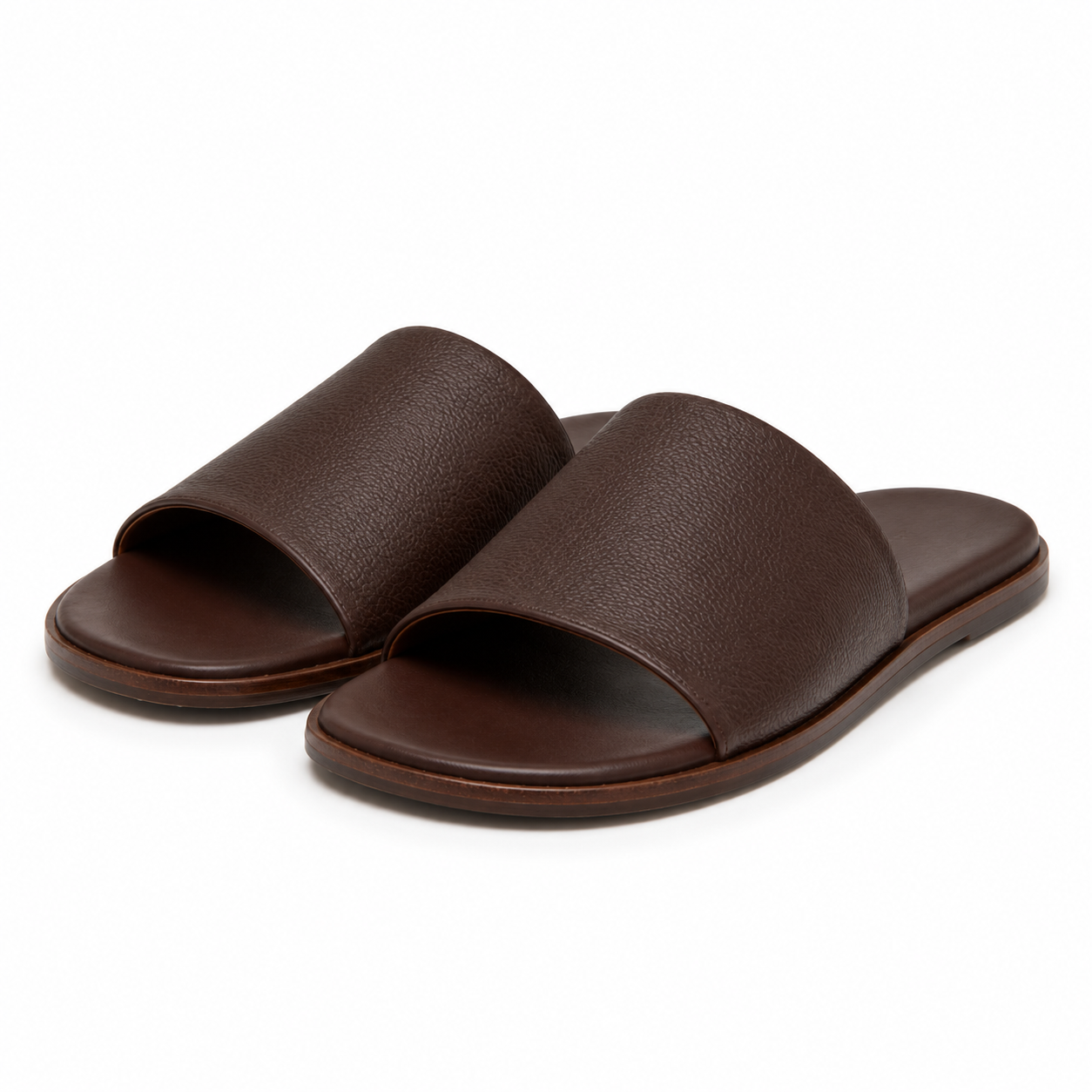 Side view of brown leather slide sandals
