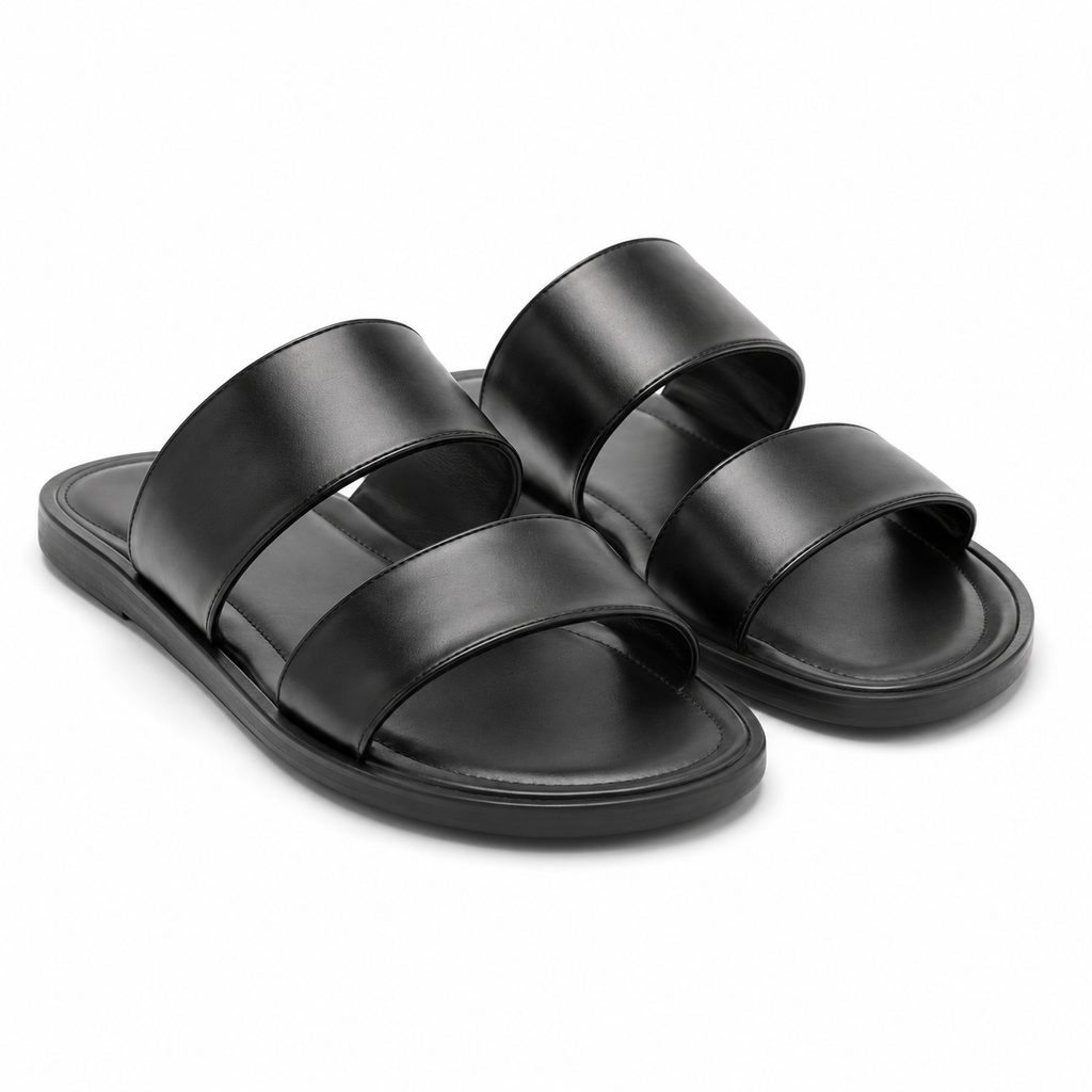 Side view of black leather sandals on a white background.