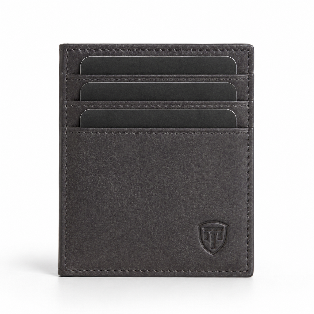 Close-up of embossed logo on leather passport holder.