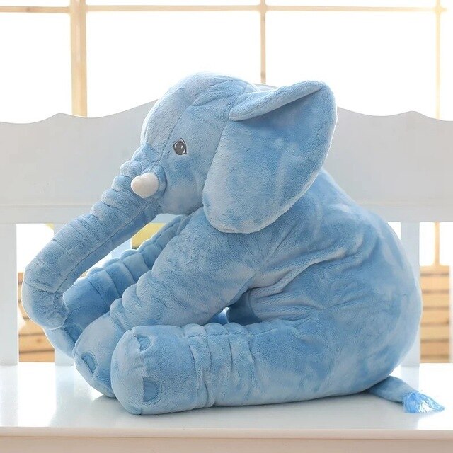Elephant cuddle pillow being used for baby nap and rest