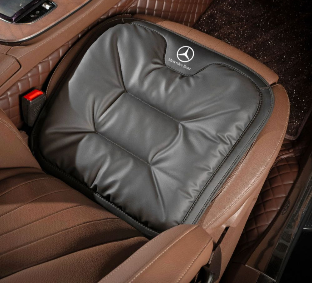 Velario ergonomic car cushion shown fitted on a car seat providing lumbar support.