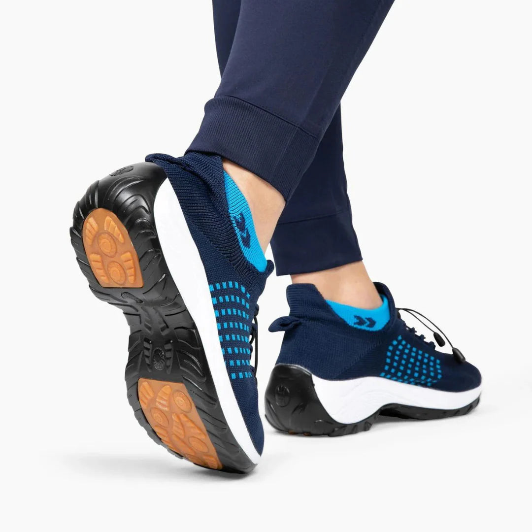 Person walking outdoors in Orthofit trainers, demonstrating versatility and comfort