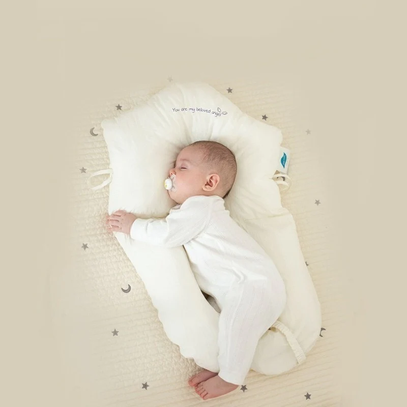 Baby sleeping peacefully in the Modish-Vogue Ergonomic Sleep Cushion, demonstrating proper head and neck support.