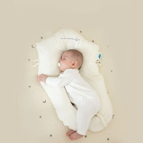Baby sleeping peacefully in the Modish-Vogue Ergonomic Sleep Cushion, demonstrating proper head and neck support.
