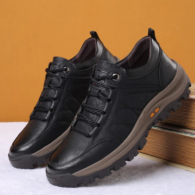 Side view of men's orthopaedic leather boots displaying ergonomic insole and arch support