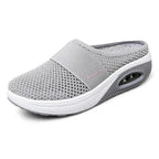 Side view of OrthoAir shoes demonstrating open practical design and modern minimalist style