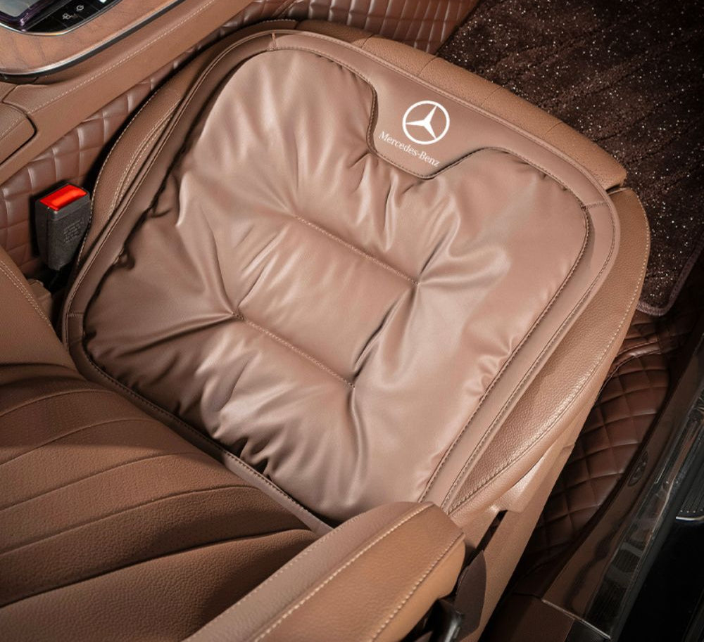 Velario car cushion in use, showing driver comfort and correct posture support.