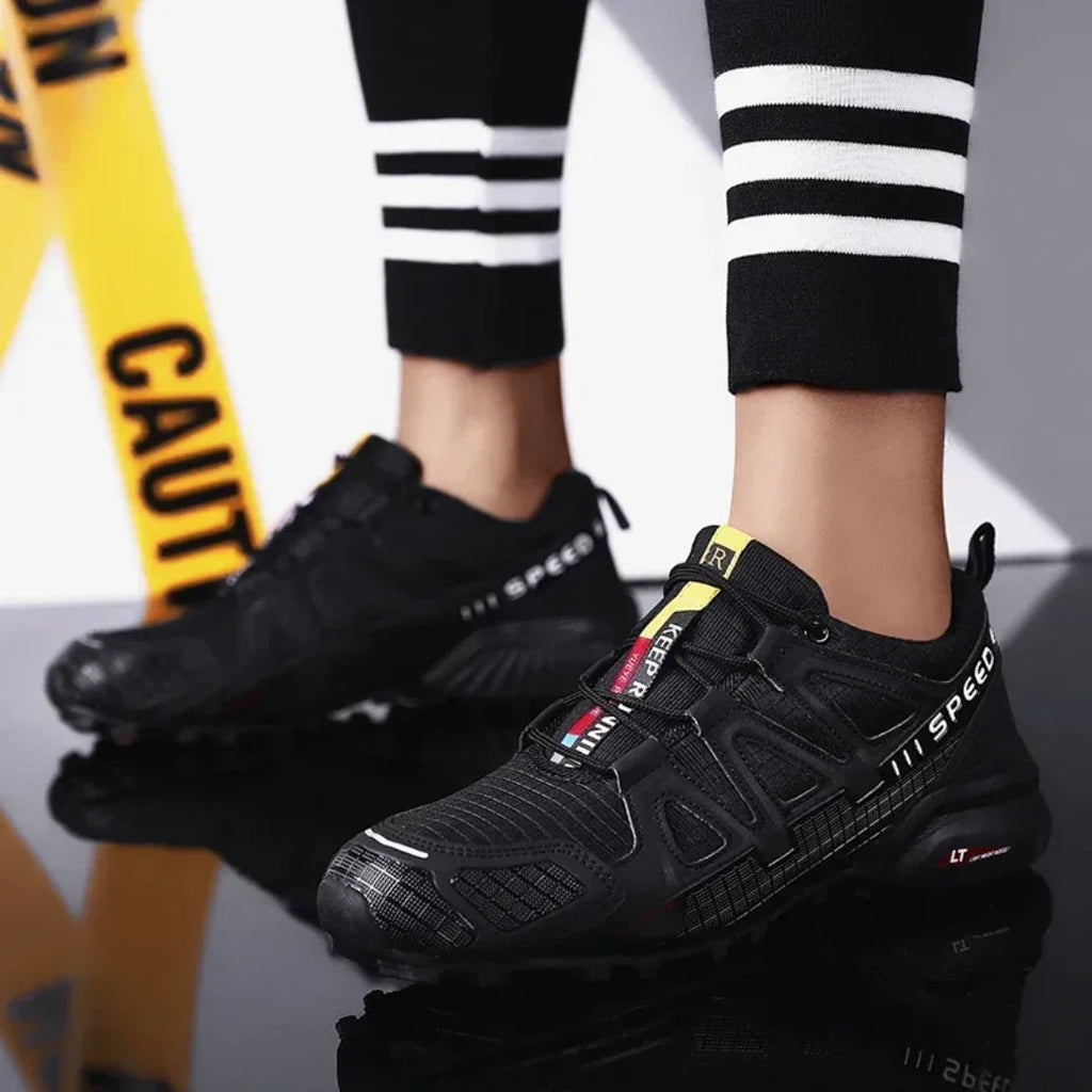 SpeedCross IV trainers detail of breathable mesh fabric and protective reinforcements.